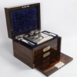 A Victorian coromandel travelling box, the interior fitted with cut-glass jars with plated tops,