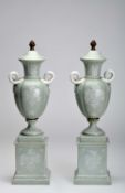 A pair of urns with covers