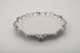 A scalloped salver wit three feet