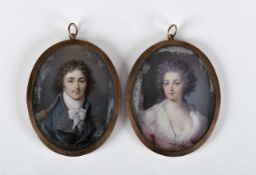 Portraits of a gentleman and a lady