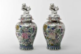 A pair of covered pots