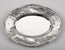 A scalloped oval platter with container