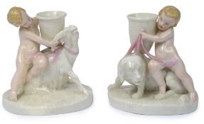 A pair of Royal Worcester figural table salts