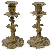 A pair of 19th century Rococo Revival ormolu candlesticks