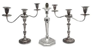 A pair of silver on copper three light candelabra and an Edwardian large electroplated table lamp