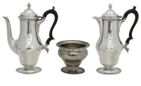 A George V silver coffee pot, hot water jug and sugar basin