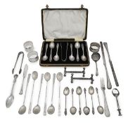 A George V silver set of six coffee spoons and tongs, with other items (qty)