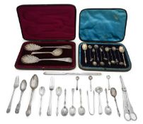 A collection of silver spoons, flatwares and other items