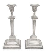 A pair of late Edward VII silver candlesticks