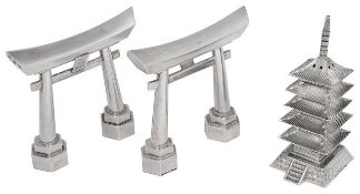 A pair of Japanese .970 silver Tori gate salt and pepper shakers and a .950 pagoda pepperette