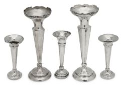 Five silver trumpet vases