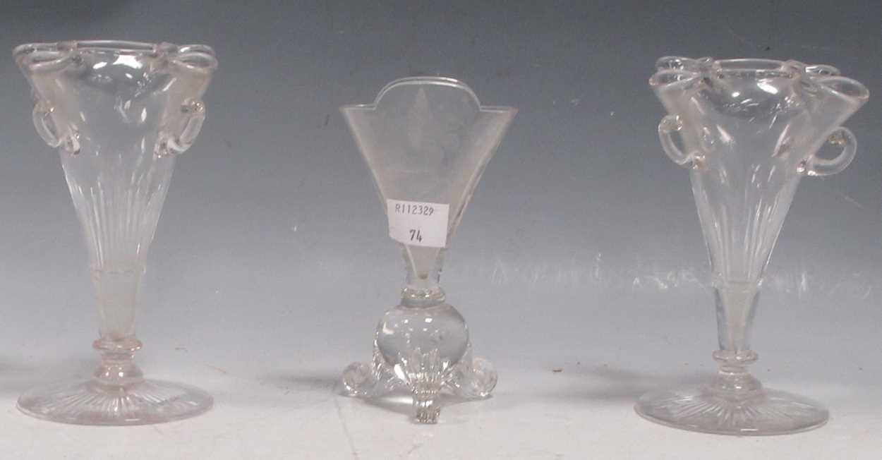 A pair of early 20th century glass spill vases, of tapered form with five divisions on circular star