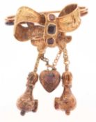 Early to mid 19th century garnet unmarked yellow metal ribbon brooch