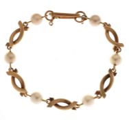 Pearl yellow metal fancy link bracelet