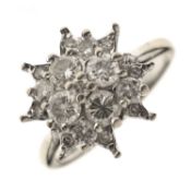 Diamond white metal cluster ring stamped 18ct