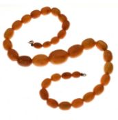 String of graduated oval butterscotch amber beads