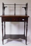 An Arts & Crafts mahogany lady's writing desk, with fold over leather inset top, gallery top and