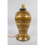 A Kashmiri papier-mache table lamp with decorative foliate panels, 32cm high