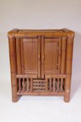 A Chinese provincial bamboo cabinet, 70 x 38cm, 86cm high