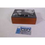 A Tandberg Model 12-21 stereo reel to reel tape recorder, with instruction manual