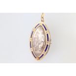 An oval pendant/brooch depicting a lady and gentleman, contained in a yellow gold, testing as 14ct