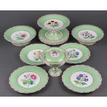 A Minton 11 piece apple green dessert service with floral decoration, the base numbered 9358