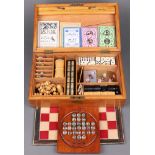 An Edwardian games compendium comprising St Georges pattern chess set (1 black rook has damage to