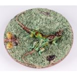 A Majolica pottery plate decorated 2 lizards, the base marked Glada 21cm