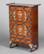 A late 19th/early 20th Century Korean hardwood cabinet with brass mounts fitted 3 drawers above