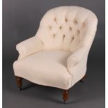 A Victorian tub back chair upholstered in white buttoned material, raised on turned supports 75cm