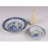 A Nankin Cargo blue and white tea bowl and saucer, the base with Christie's labels, a shaped blanc