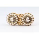 A 19th Century, yellow gold, testing as 22ct, bar brooch formed of 2 roundels, each set an old