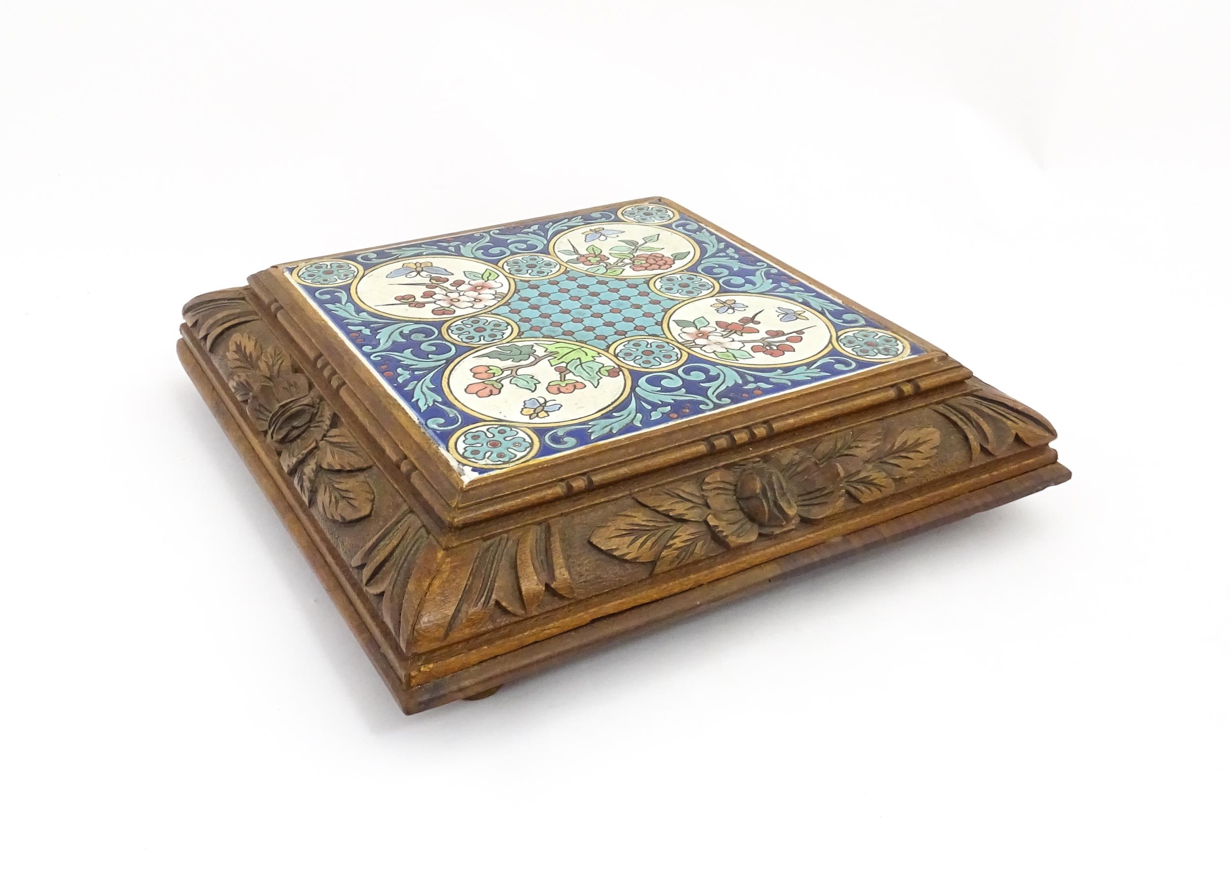 A 20thC carved wooden teapot stand set with Longwy tile to top having floral and foliate decoration, - Image 5 of 9