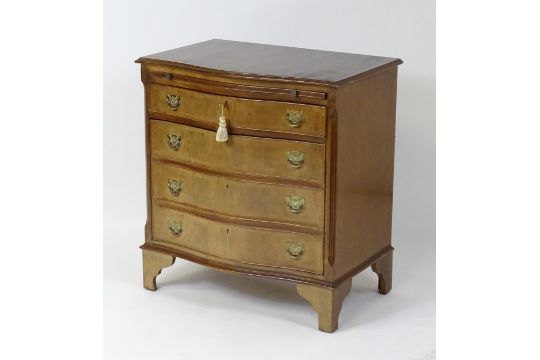 A late 20thC mahogany serpentine fronted chest with a brushing slide, above a hinged door raised - Image 7 of 7