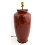 A table lamp with red glazed ceramic vase base. Approx. 18 1/2" high Please Note - we do not make
