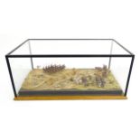 A 20thC diorama model of a Roman battle scene. Case approx. 7 3/4" x 19" x 11" Please Note - we do