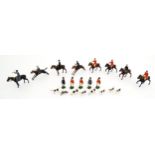 Toys: A quantity of Britains Ltd. lead hunting figures to include huntsmen and women on horseback,