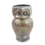 An Arts & Crafts Farnham pottery style owl jug with silver plate overlay. Unmarked. Approx. 6 3/4"