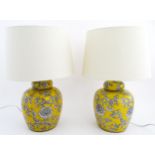 A pair of late 20th / early 21stC table lamps of ginger jar form with floral detail. Approx. 12"