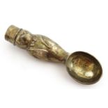 A novelty silver plate ice cream scoop modelled as a penguin wearing a top hat, jacket and bow