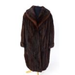 Vintage fashion / clothing: A vintage Musquash fur coat with receipt from Weald Furriers Ltd,