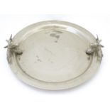 A silver plate tray of circular form with twin stag head handles, by Kenneth Turner of London.