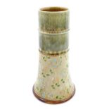 A Royal Doulton spill vase of tapering form decorated with flowers and foliage, by Maud Bowden.