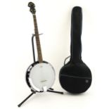 Musical Instrument : a Countryman five string banjo, together with case, stand and sheet music