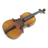 A continental early 20thC student's half size violin. Labelled to the interior 'Sebastien Kloz',