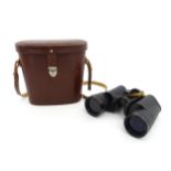 A cased mid 20thC pair of Carl Zeiss Jenoptem 10x50W binoculars, serial number 4600542, Approx 7"