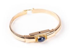 Bracelet jonc en or rose orné d'un saphir bleu