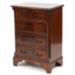 A late 20th century George III style mahogany chest of two short and three long drawers on bracket