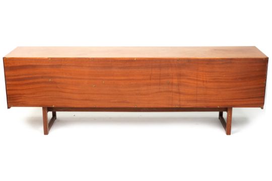 A mid 20th century teak sideboard fitted with three drawers and cupboards on sled supports. - Bild 4 aus 4