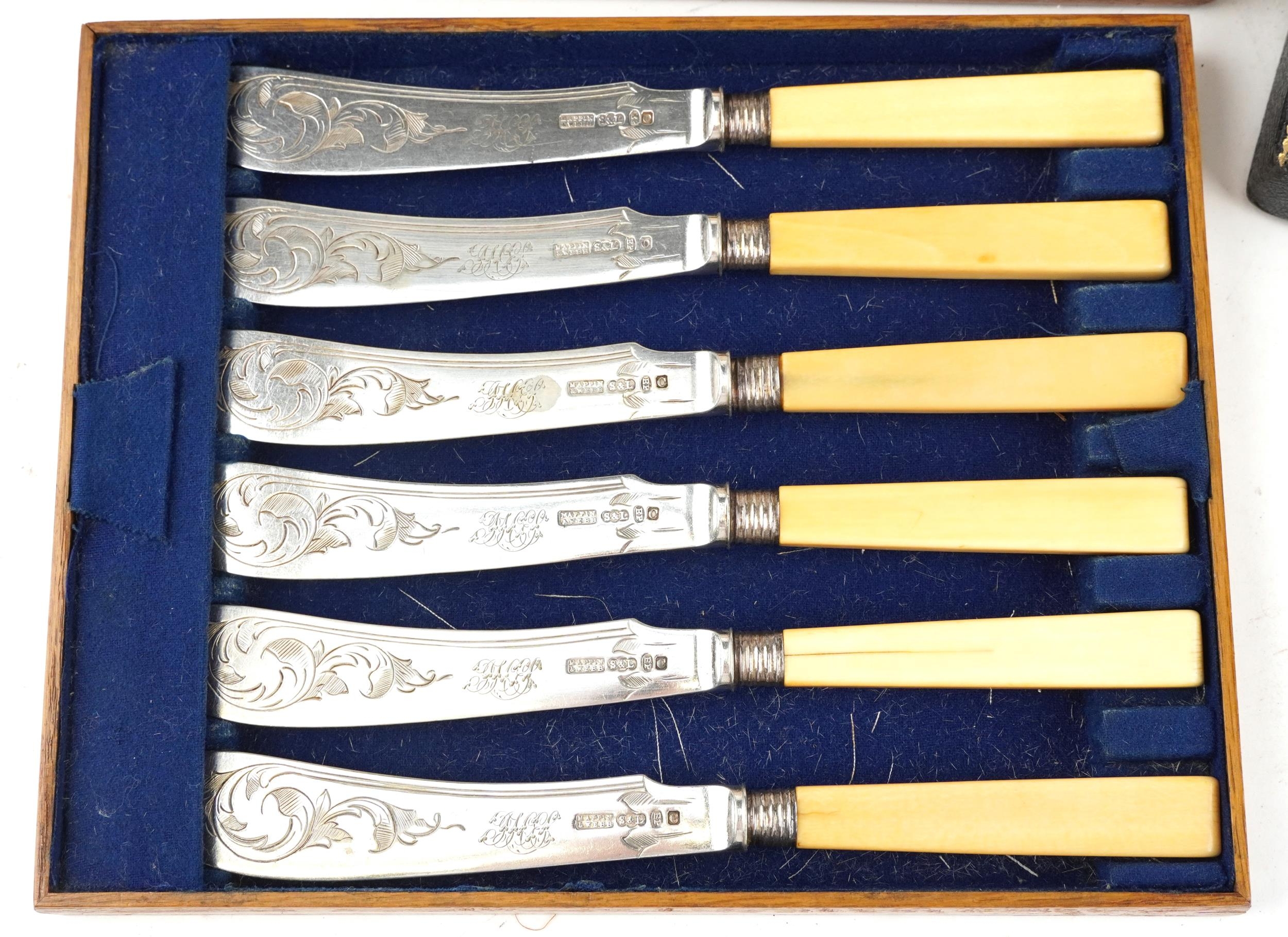 An early 20th century Mappin & Webb plated set of fish knives and forks with bone handles within a - Image 2 of 9